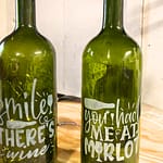 Upcycled wine bottle lanterns with etched lettering created at The Craft Cottage in Grafton NH