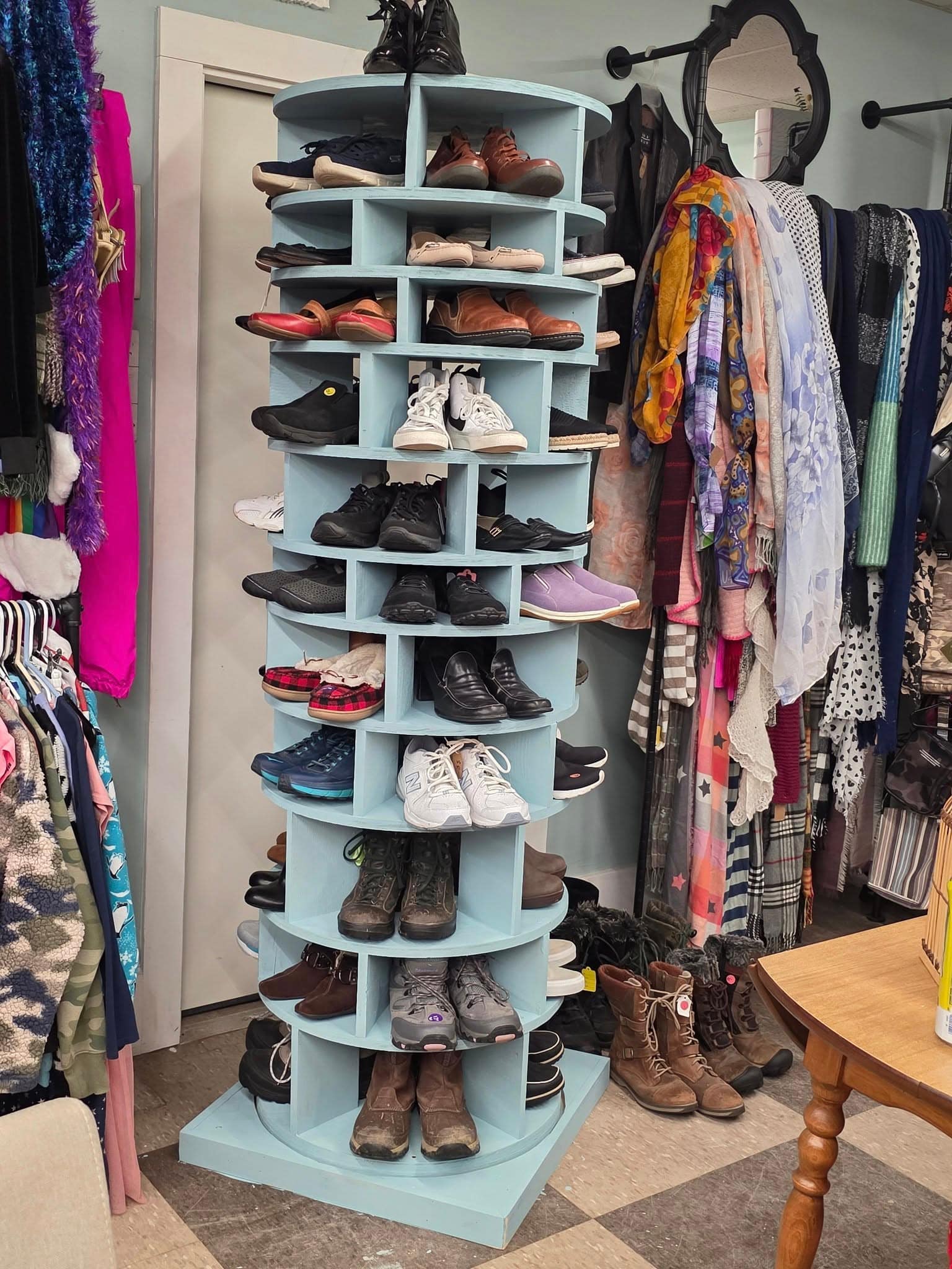 Secondhand shoes and clothing displayed inside Secondhand Sanctuary thrift shop in Grafton NH