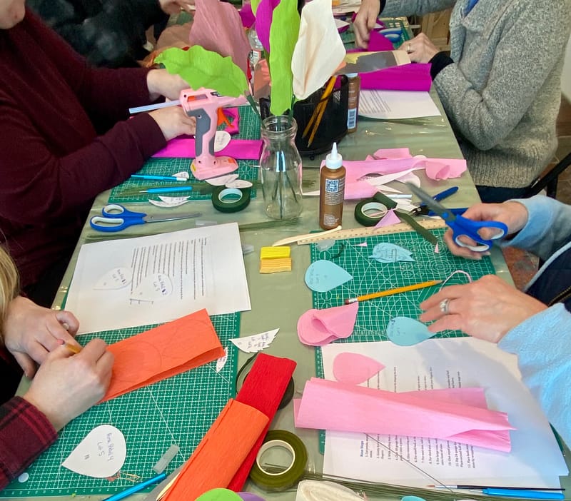 Participants making crepe paper flowers during a Craft Cottage class in Grafton NH